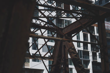 rusted steel bridge and condo building