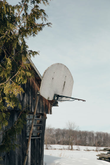 rustic old basketball net in an old barn