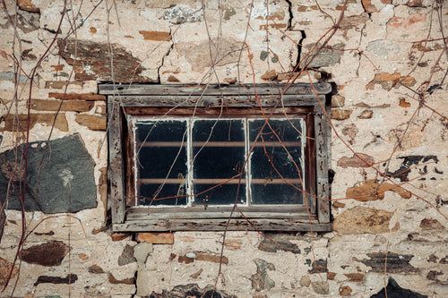 rustic old window in a stone building