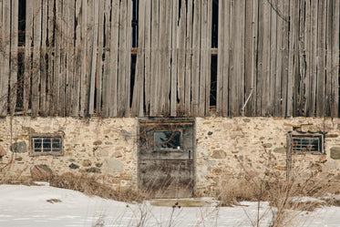 rustic wooden barn on a stone foundation