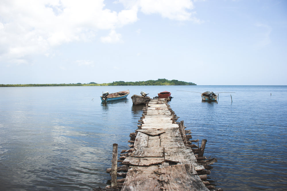 rustic wooden pier on calm lake