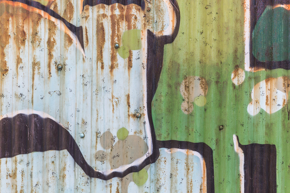 rusty green tin graphitti wall texture