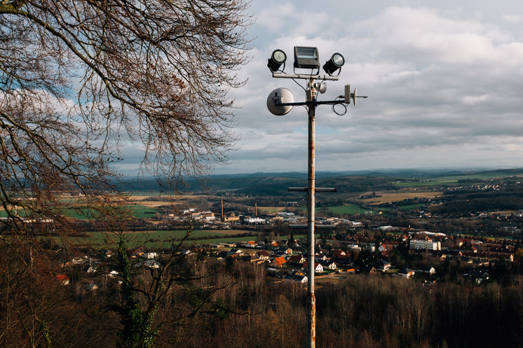 Rusty Post Overlooking Small Village