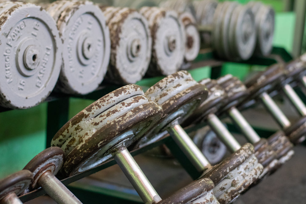 rusty weights on a rack