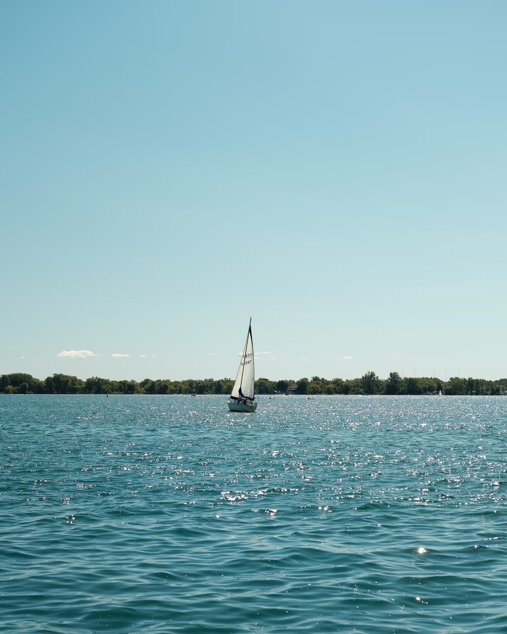 sail floats boat on the water