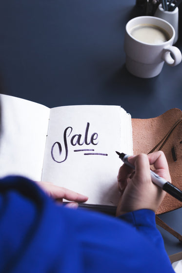 sale written in notebook