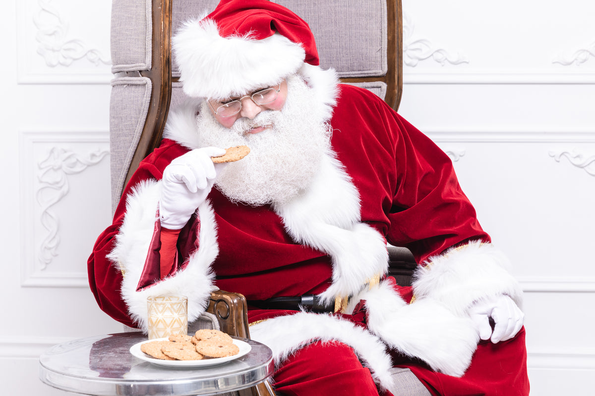 santa eats a cookie