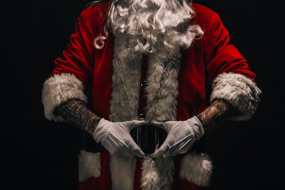 santa holds his belt