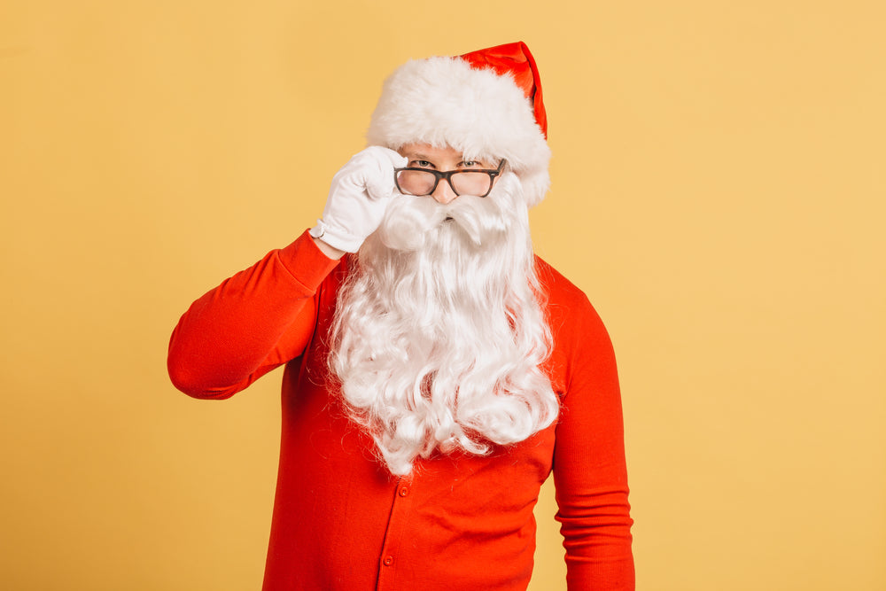 santa looks over glasses rims