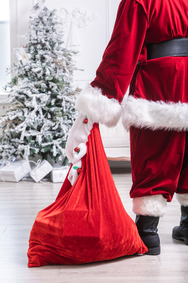 santa sets down his bag of toys