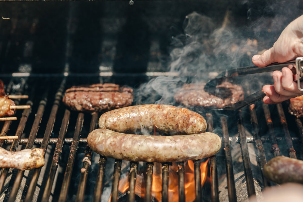 sausages and burgers on a grill