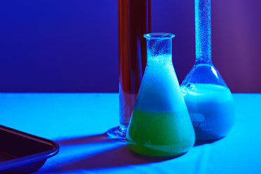 science beakers in blue light