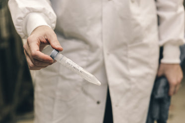 scientist holding frozen test tube