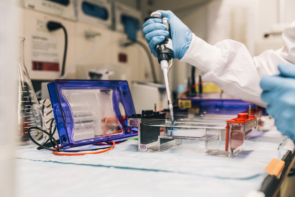 scientist in lab with pipette