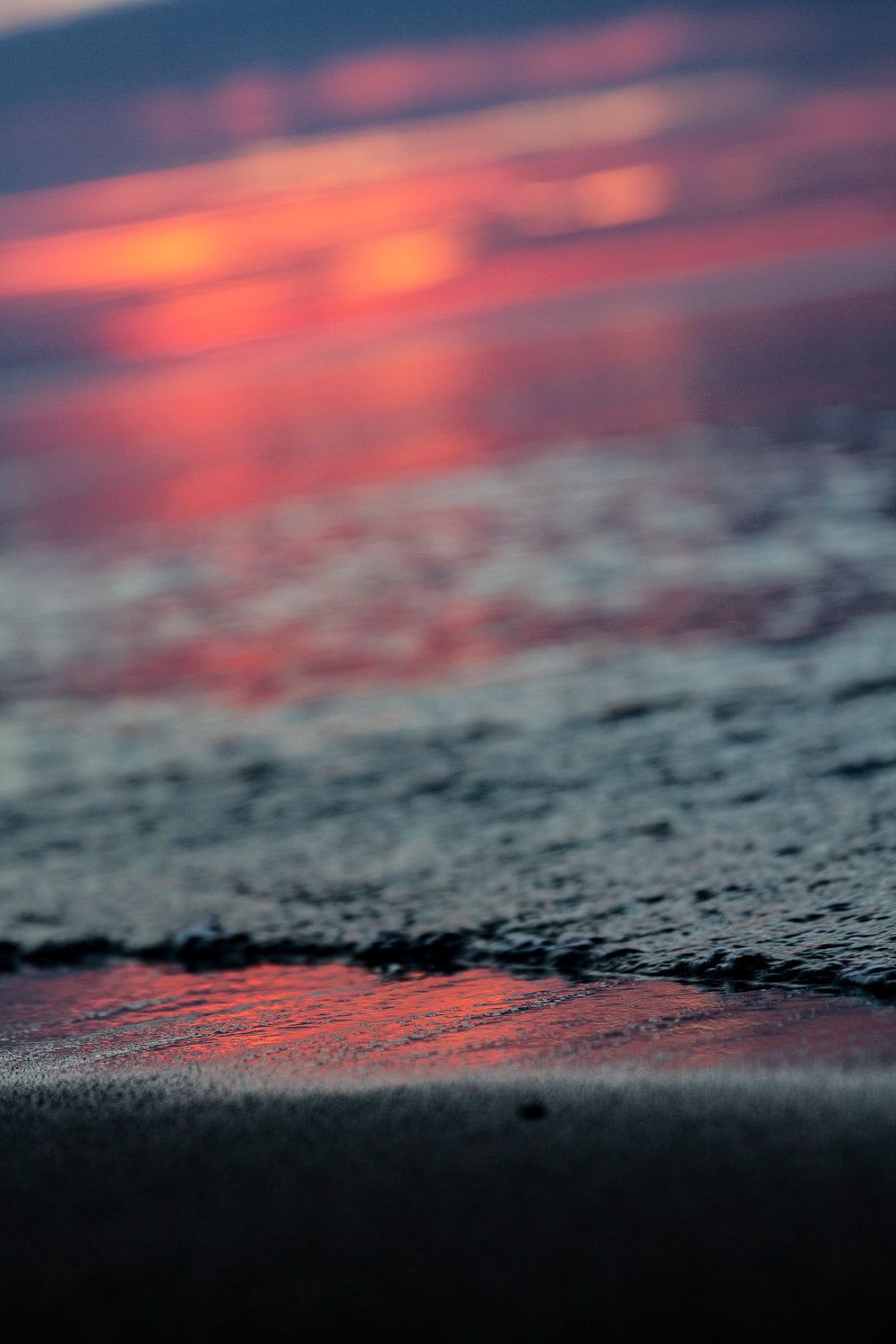 setting sun reflected in low tide