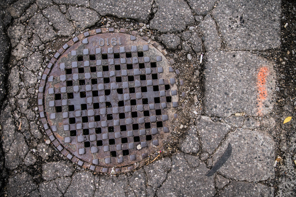 sewer grate in pavement