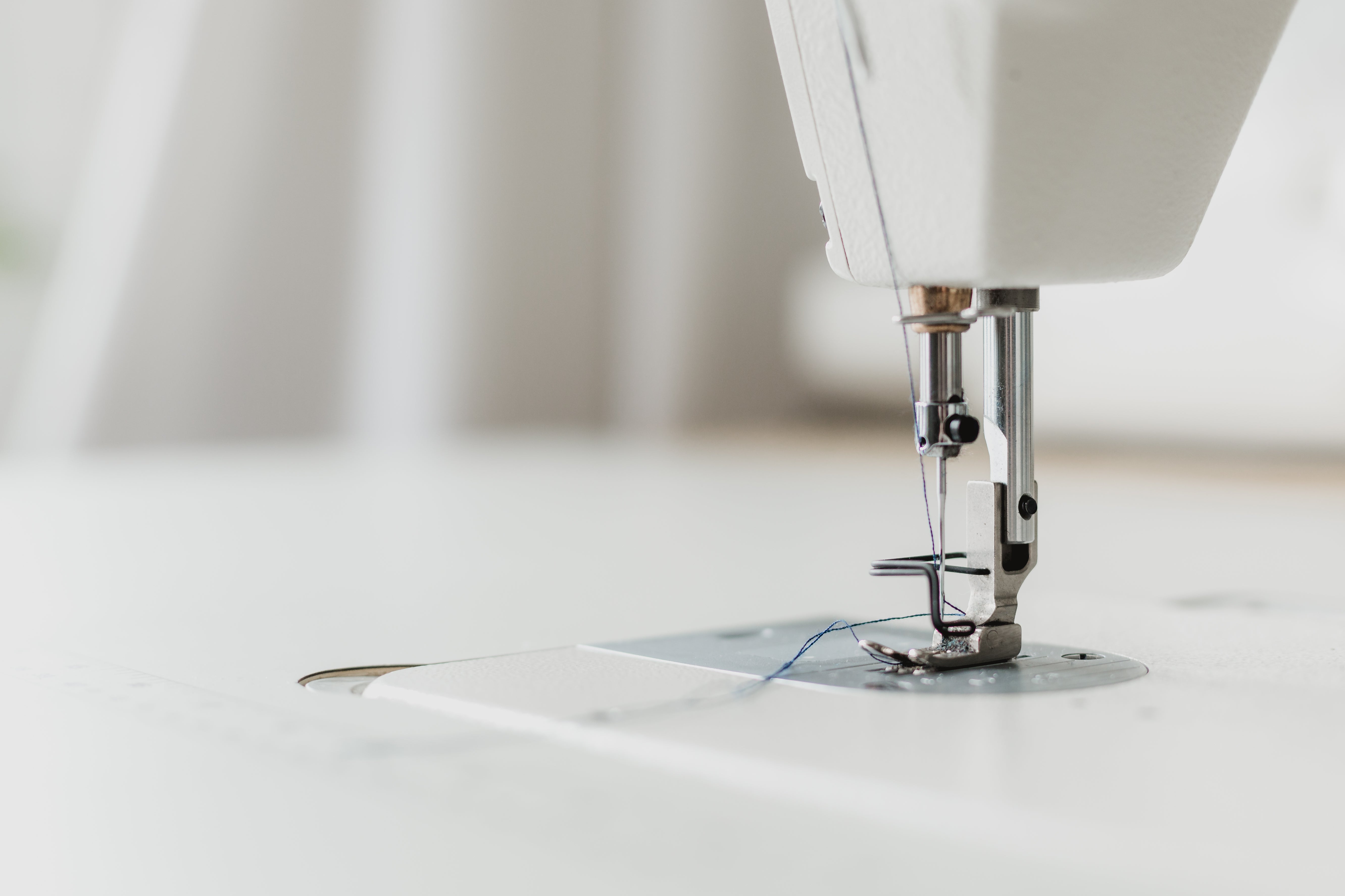 Premium Photo  Close up of a needle and a pin stuck in a sewing