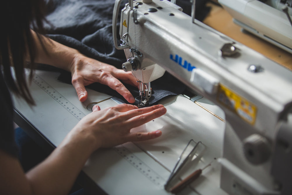 sewing some fabric with machine