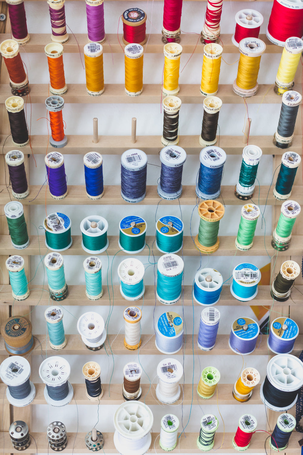 colorful sewing threads on wall