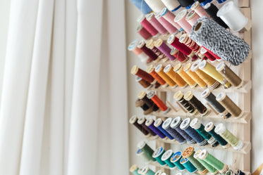 Free Sewing Threads On Wall Photo — High Res Pictures