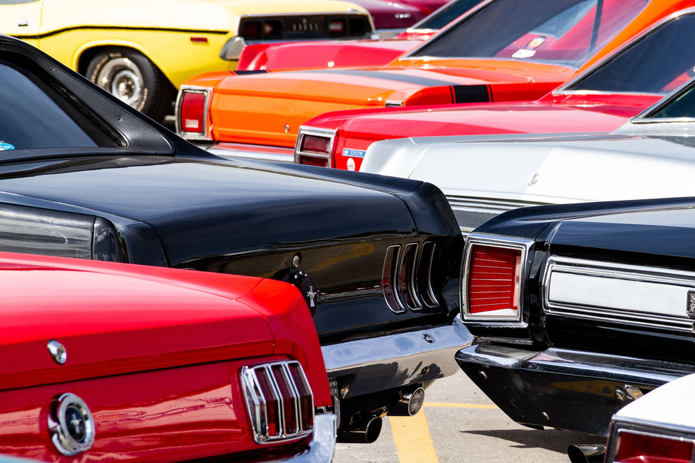 shiny bumpers and lights of vintage cars