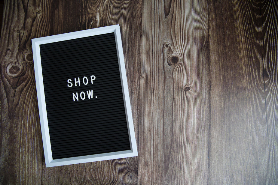 Picture of Shop Now Diagonal Sign On Wood — Free Stock Photo