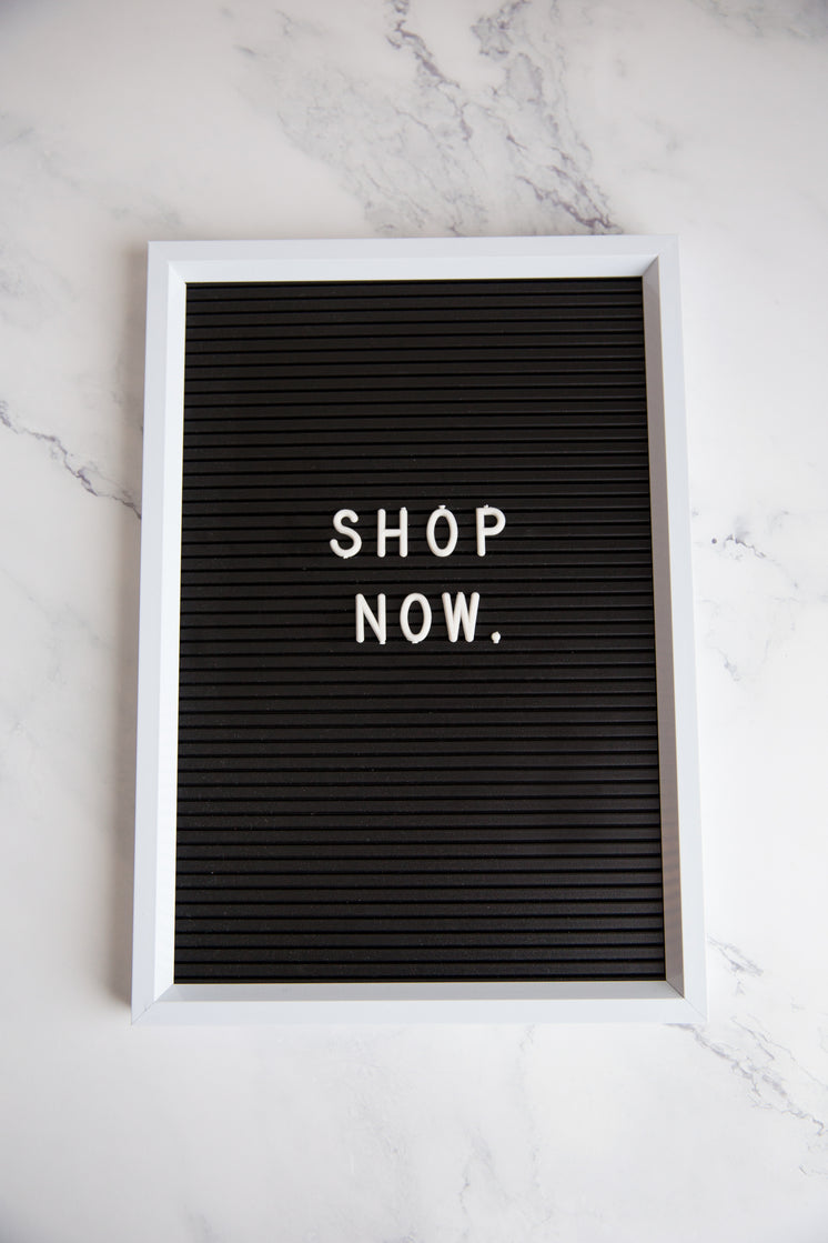 Shop Now Sign On Marble