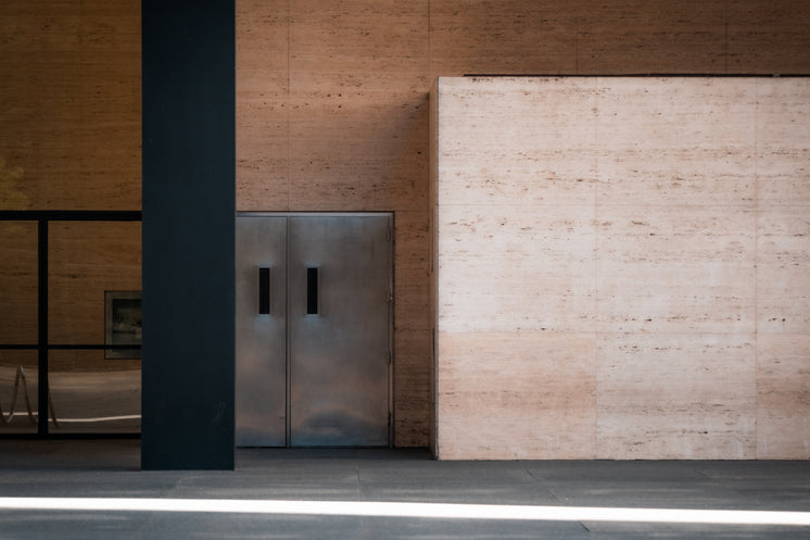 Side Of A Building With Silver Doors