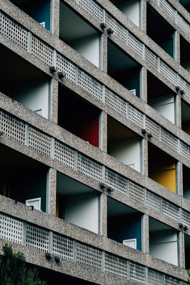 side of an angled building with balconies