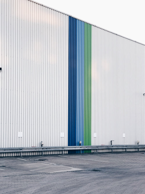 side of warehouse building with stripes