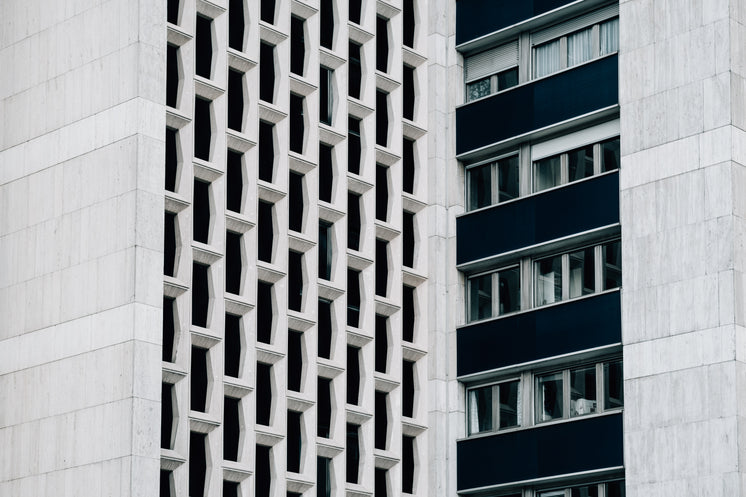 side-of-white-building-with-windows-and-