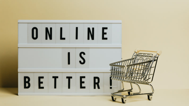 Sign Says Online Is Better With A Small Shopping Cart