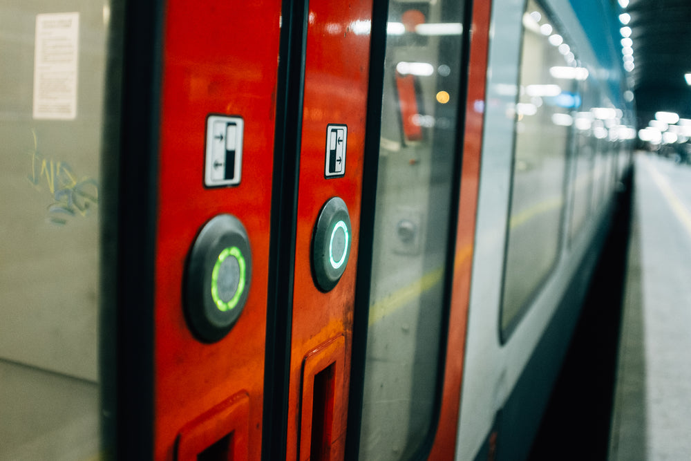 signs on red subway doors