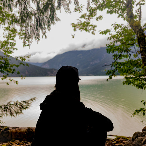 Silhouette Of A Young Person Looking At The Landscape