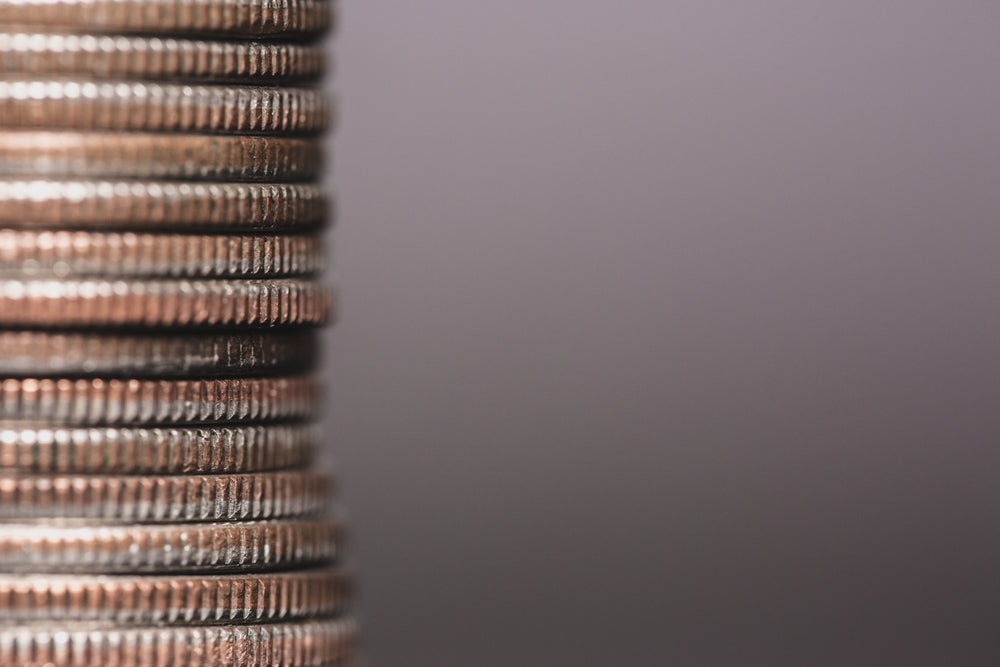 silver coin stack on left of image