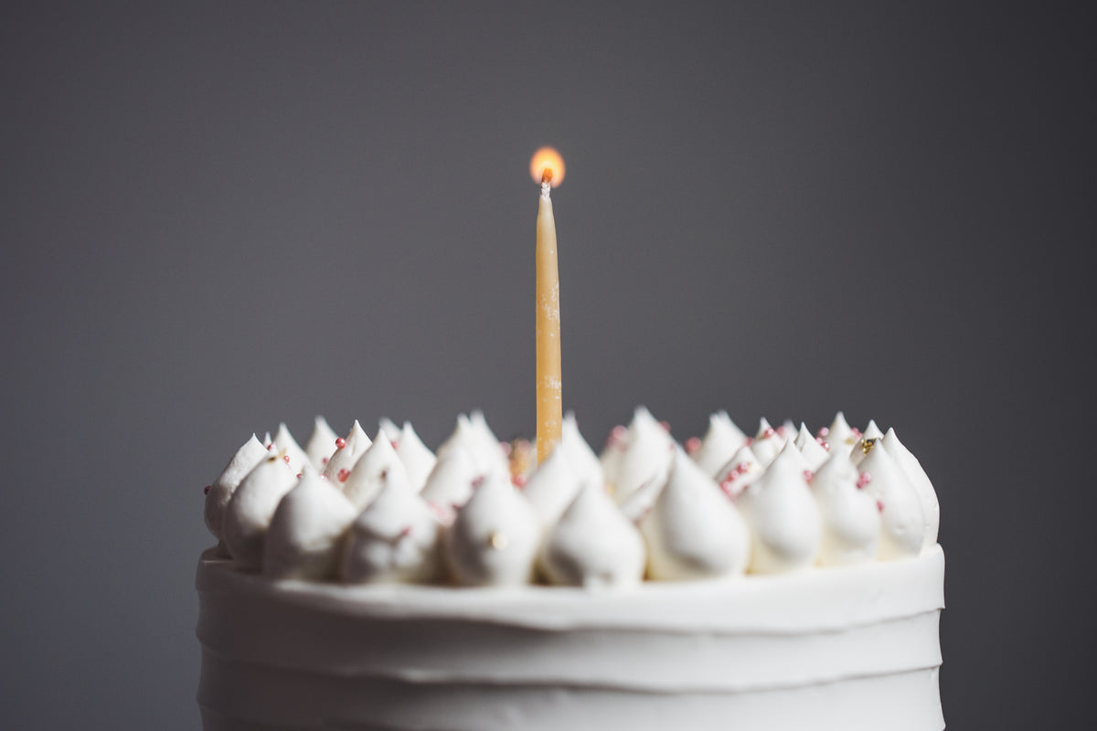 single candle on birthday cake