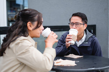 sipping from to go coffee cups