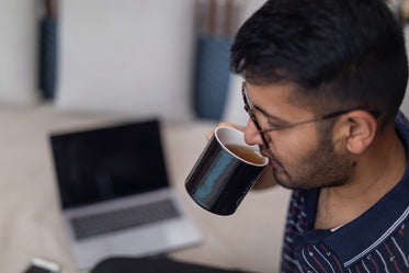 sipping tea in modern workspace