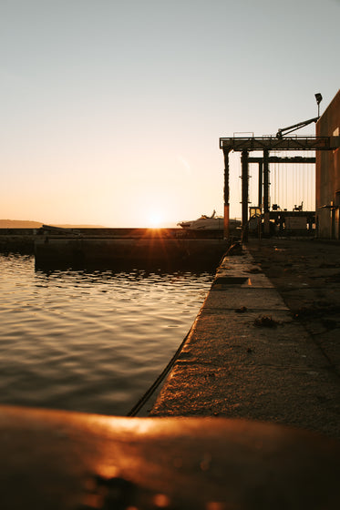 sitting on the dock at sunset