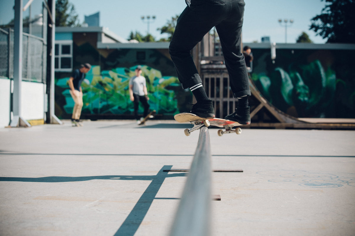 skateboarder locking into a feeble grind