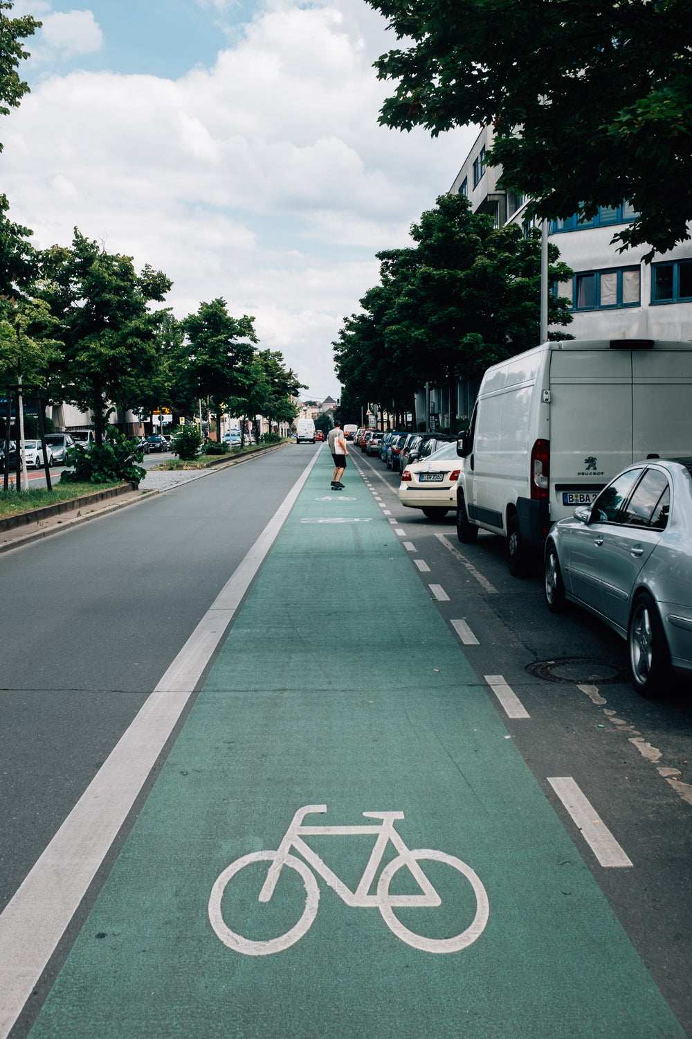 skateboarder using the bike lane on a sunny day