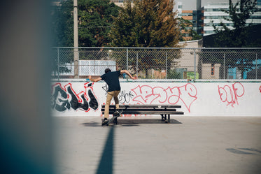 skateboarding onto picnic table