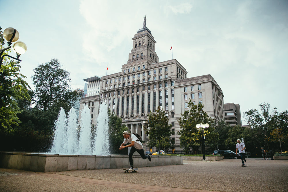 skateboarding past fountain