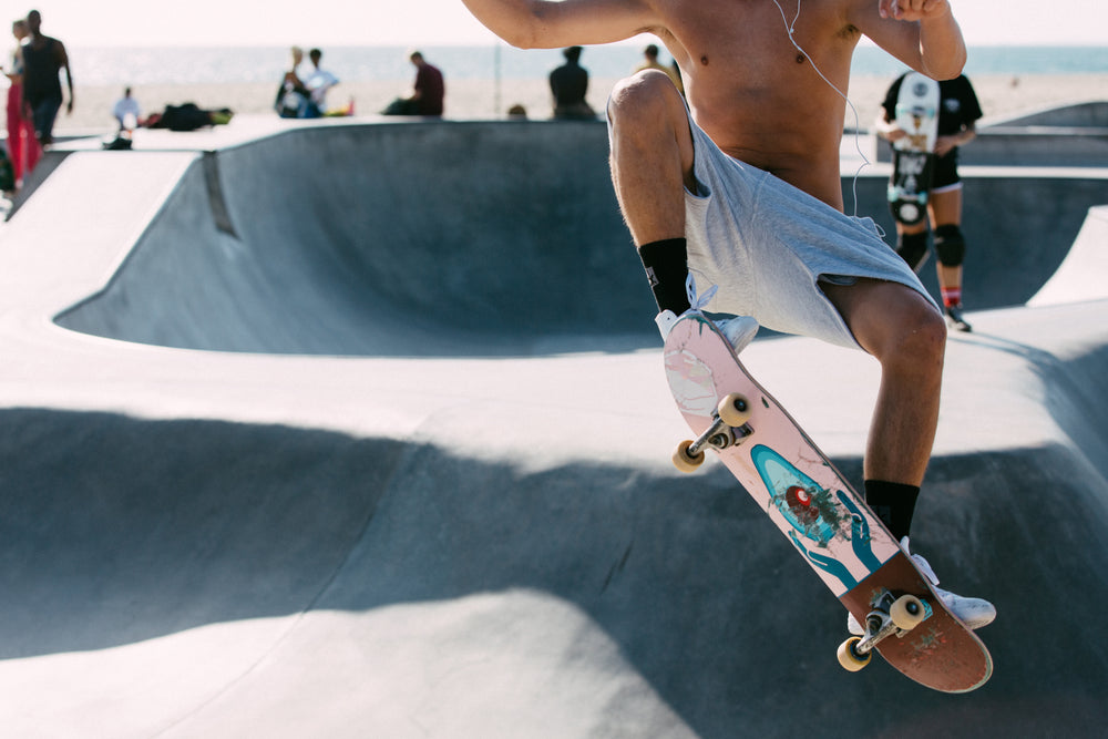 skater shredding bowls in the sun