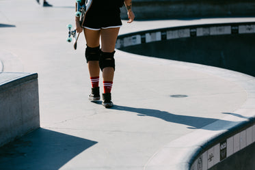 skater walking in skateboard board in hand