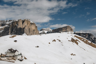 ski hotel under rocky mountain range