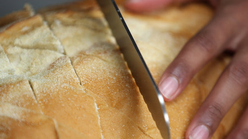 slicing fresh bread
