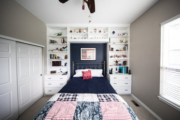 small bedroom with shelving