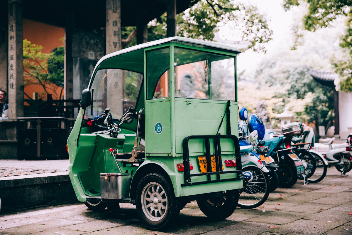small green auto rickshaw