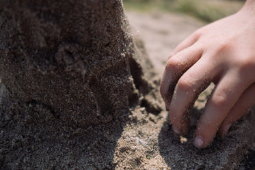 small hand in the sand